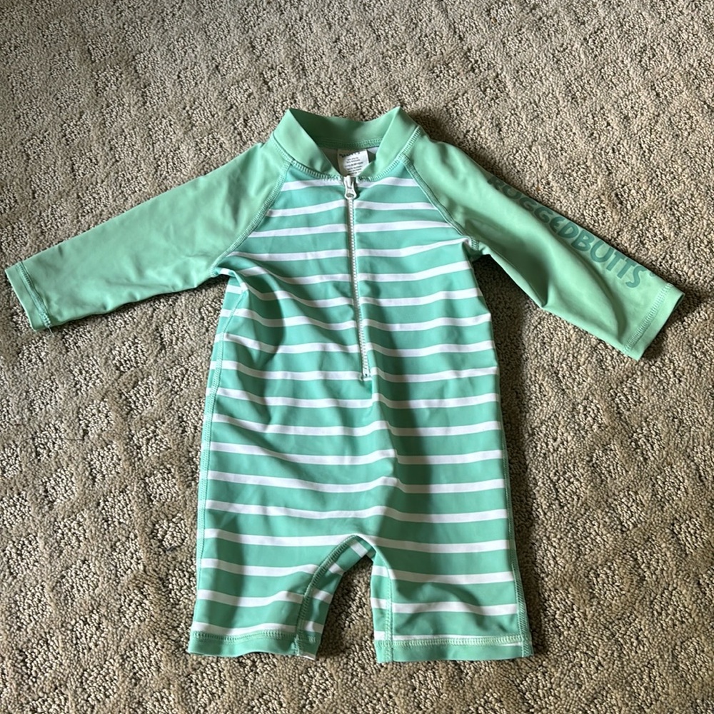 Like new Rugged Butts one piece rash guard bathing suit